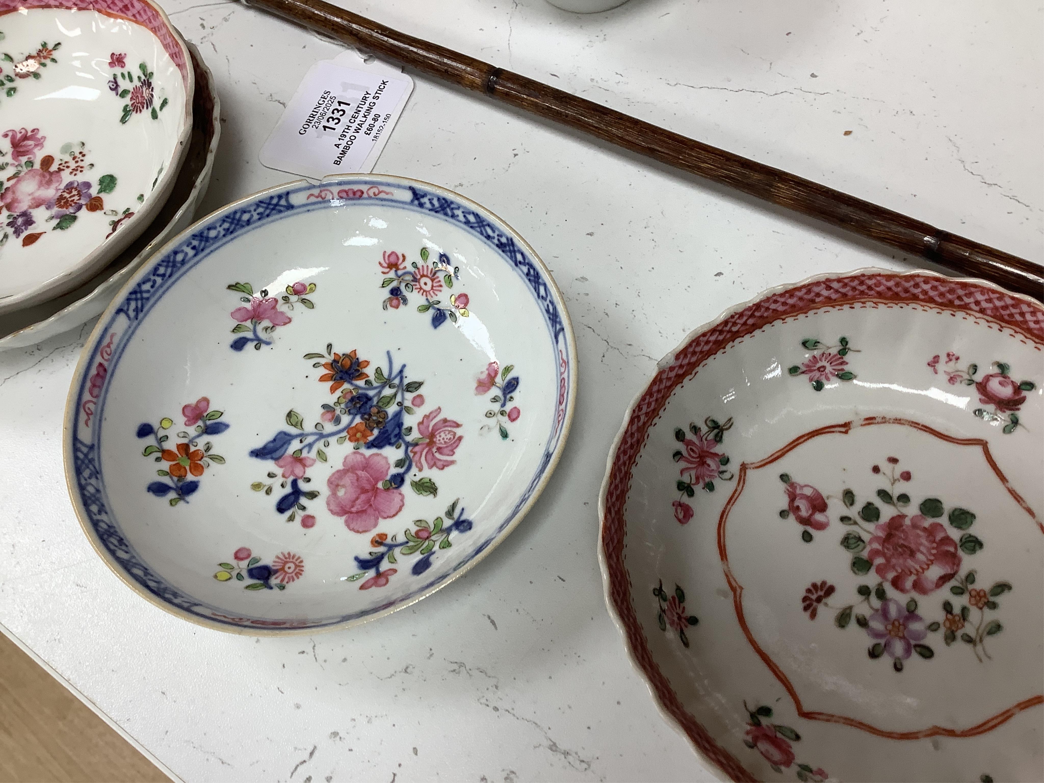 A collection of 18th century Chinese export and English porcelain to include tea bowls and saucers, largest saucer 14cm in diameter